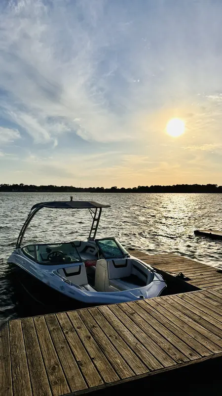 Yamaha AR190 at a wooden dock on Lake Conroe with the sun low and golden over the water